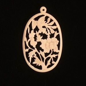 Carved floral pendant